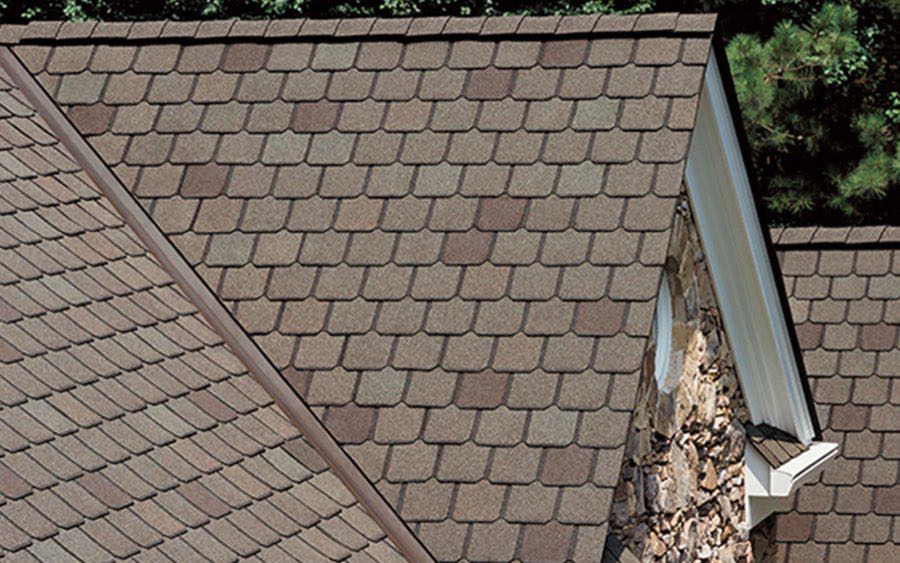 Close-up of a newly installed architectural shingle roof with clean gutter line on a Wichita-area home